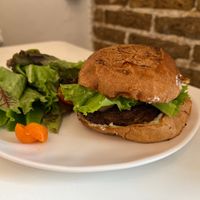 Vegan hamburger and salad .  at Yegolé Termopolio in Oaxaca