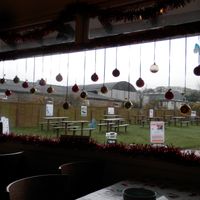 Cafe decorated for Christmas.  Also showing outdoor seating area. at Hillside Shire Horse Sanctuary Cafe in West Runton