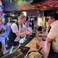 Sitting up at the bar   at Fire Cafe in Osaka