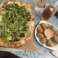 Vegan Rocket Flatbread & vegan fried artichoke hearts with Sriracha ranch.   at Hearth & Tap Co in Montvale