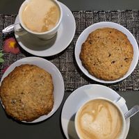 Italian styled coffee with almond and peanut milk. A delicious soft and big chocolate, banana and  oat cookie.   at Logros Café in Jujuy