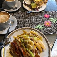 Italian styled coffee with almond and peanut milk.  Wholemeal waffles with fruits, seeds and sugarcane sirup. Toasts with hummus and avocado spread. at Logros Café in Jujuy