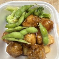 Vegan Orange chicken mixed with leftovers of edamame  at Sakura Sushi in Magalia