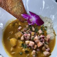 Brunch: pumpkin chickpea curry | stone-ground coconut grits | apple pico de gallo | fried socca  at Pimiento Tea Room in Holly Springs