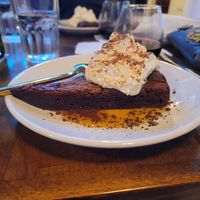 GF Vegan Raspberry Brownie with Caramel & Whipped Cream at Pimiento Tea Room in Holly Springs