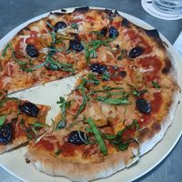 Vegan cheese. Calamata olives. Sundried tomatoes. Basil. at Flyover Brewing Company in Scottsbluff