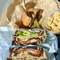 Turkey club and Philly cheesesteak with macaroni salad   at Ben & Esther's Vegan Jewish Deli in Portland