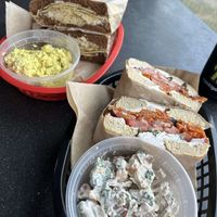 Siegler Sammy with egg salad (left), LOX bagel with loaded baked potato salad (right) at Ben & Esther's Vegan Jewish Deli in Portland