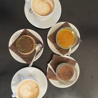 Cappucinos, pistachio and salted caramel cake, mango cheesecake and tiramisu.   at Cortese Café 900 in Florence