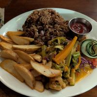 Saute veggies in Traditional Caribbean sauce with a side of rice & beans and papas, and a cute tiny raw salad. at El Sol Del Caribe in Puerto Viejo De Talamanca