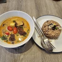 Red curry with vegan duck, cherry and grapes at Khun Churn in White in Bangkok