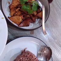 Tofu Kra-tiem - Deep Fried Tofu with Garlic and Ground Pepper 

Plus a side of Brown Rice at Khun Churn in White in Bangkok