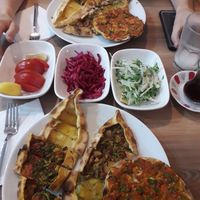 Sharing platter for 2 (lahmacun, pide with vegan meat, cheese, potato&cheese, mushrooms) at Vegan Masa in Istanbul