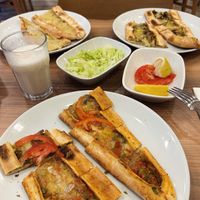 Potato and cheese pita, mushroom and cheese pita, (complimentary tomatoes and chopped lettuce) minced-meat cheese pita with ayran. at Vegan Masa in Istanbul