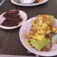 Avo toast with tofu scramble and tempeh bacon on the side  at Millie's Cafe in Los Angeles