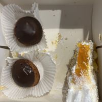 The cake was already half eaten here 😬😅 Mango passion fruit cake and vanilla choux  at Cloud Cakes -  Notre Dame de Lorette in Paris