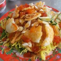 Crispy fried noodles with peanuts, sweet chilli and tomatoe sauce, lettuce and mint. at Tam Thien in Hue