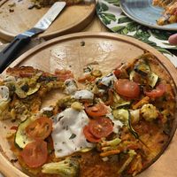 Vegan gluten free pizza with almond cheese and dried tomato wheat bread  at Charcuteria  in Barichara