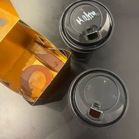 Two hot drinks, a brownie and pistache praline at Enso in Limassol