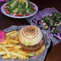 Full vegan burger, mushroom buns, salad at Lado V in Buenos Aires