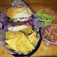 K-pop burger with nachos, pico de gallo, guacamole at Lado V in Buenos Aires
