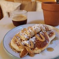 Robin's pancakes (banana, homemade pb, maple syrup) and double espresso.  at De Bon'heur in Marseille