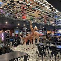 Inside the food court in the bar area with seating  at Kitchen Market in Lille