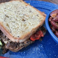 Roman Holiday; hummus, mushrooms, olive tapenade and peppers w maple glaze on amazing bread with awesome baked beans    at Old Cuss Cafe in South Salt Lake