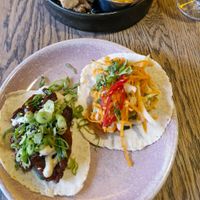 (Right) bhan mi tofu taco: crispy fried tofu, cucumber, carrot, cabbage, chilli, coriander, sweet chilli sauce & toasted sesame mayo at Wolf at the Door in Manchester