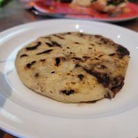 Bean and cheeze pupusa before the toppings at Mama's International Tamales in Los Angeles