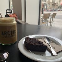 Iced latte with oat milk & sweet potato brownie   at Arctic Juice and Cafe in Lyon