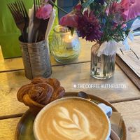 Oat latte and cinnamon bun  at The Coffee Hut in Helston