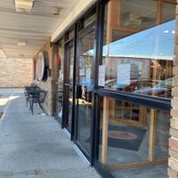 Exterior seating and entrance  at Sittoos in Parma