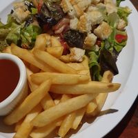 Salad with fries at Zephyr in Lanquin