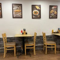 2 sets of tables for eating in at Bánh mí Vegan Vietnam in Hanoi