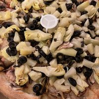 Vegan cheese pizza with artichoke hearts, olives, mushrooms, and pineapple at Megatoppers in Bullhead City