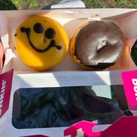 smiley cream and boston cream donuts  at Dunkin' - Stationsplein in Amsterdam