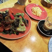 Vegan toast and oat milk iced coffee at Zenith Brunch & Cocktails in Madrid