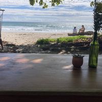 Ocean view seating at Rocamar Beach in Santa Teresa