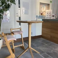 You can sit in chairs or on a bench. I have a big butt so I chose the bench.  at Dolala in Yokohama