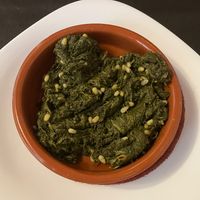 Salteado de espinacas con piñones  at Cocina Típica La Extremeña in Merida
