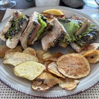 Sandwich contains olive tapenade, almonds, and veggies. On Madeira flatbread. Good portion and really tasty.  at Conchinha in Porto Moniz