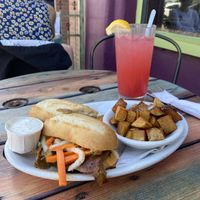 Bahn Mi (with seitan), fried garlic potatoes, side of ranch & fresh squeezed raspberry lemonade at Sweet Melissa Cafe in Laramie