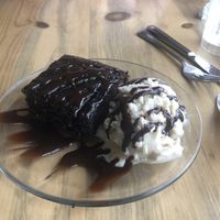 Chocolate cake with a scoop of vegan ice cream  at Sweet Melissa Cafe in Laramie