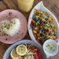 Chickpea curry with mango and coconut rice, as well as sweet potato fries with crazy yummy mayo and garlic aioli  at Eduardos Hideaway in Noord