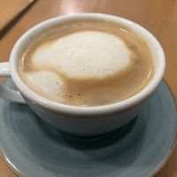 Lungo coffee with steamed oat milk  at Eduardos Hideaway in Noord