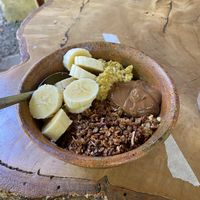 Golden Porridge (creamy homemade macadamia butter & choco coco Granola)  at The Emporium in San Marcos La Laguna