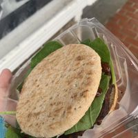Veggie burger with vegan Swiss, spinach, and bbq sauce  at Turning Natural in Washington