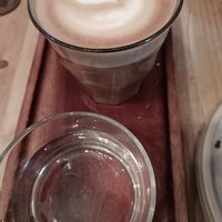 Coffee and glass of water that came with it at Gecko Coffeehouse in East London