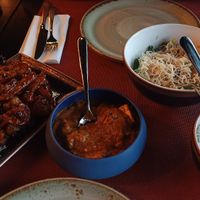 In the blue bowl there's cheese. The other ones are vegan. at Gan Bei in Riga